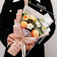 a person holding a bouquet of flowers in their hands