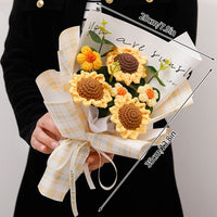 a person holding a bouquet of sunflowers