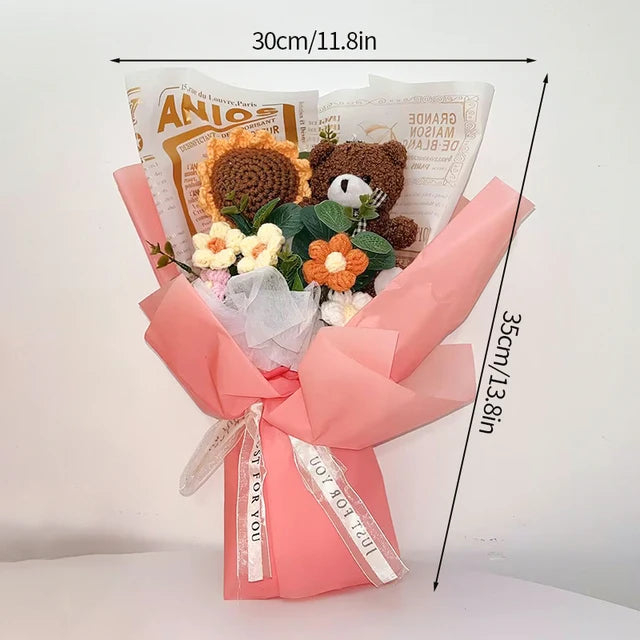 a bouquet of flowers is wrapped in pink paper