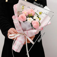 a woman holding a bouquet of flowers in her hands