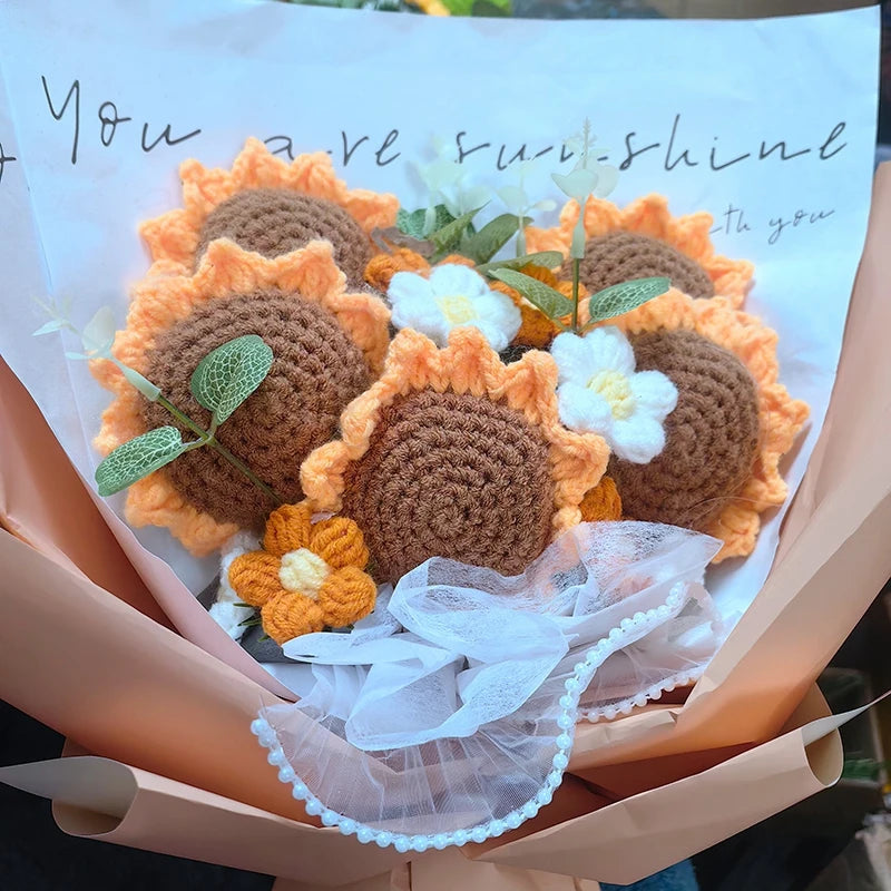 a bouquet of crocheted sunflowers in a paper bag