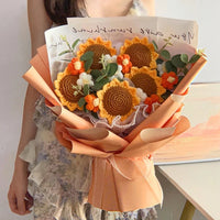 a woman is holding a bouquet of flowers