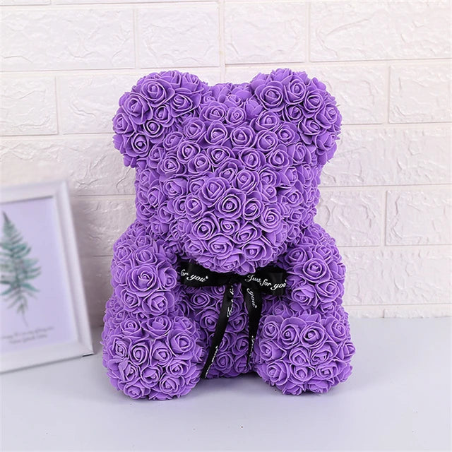 a purple teddy bear made out of roses