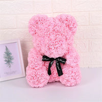 a pink teddy bear made out of roses