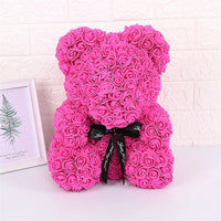 a pink teddy bear made out of pink roses