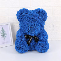 a blue teddy bear made out of roses