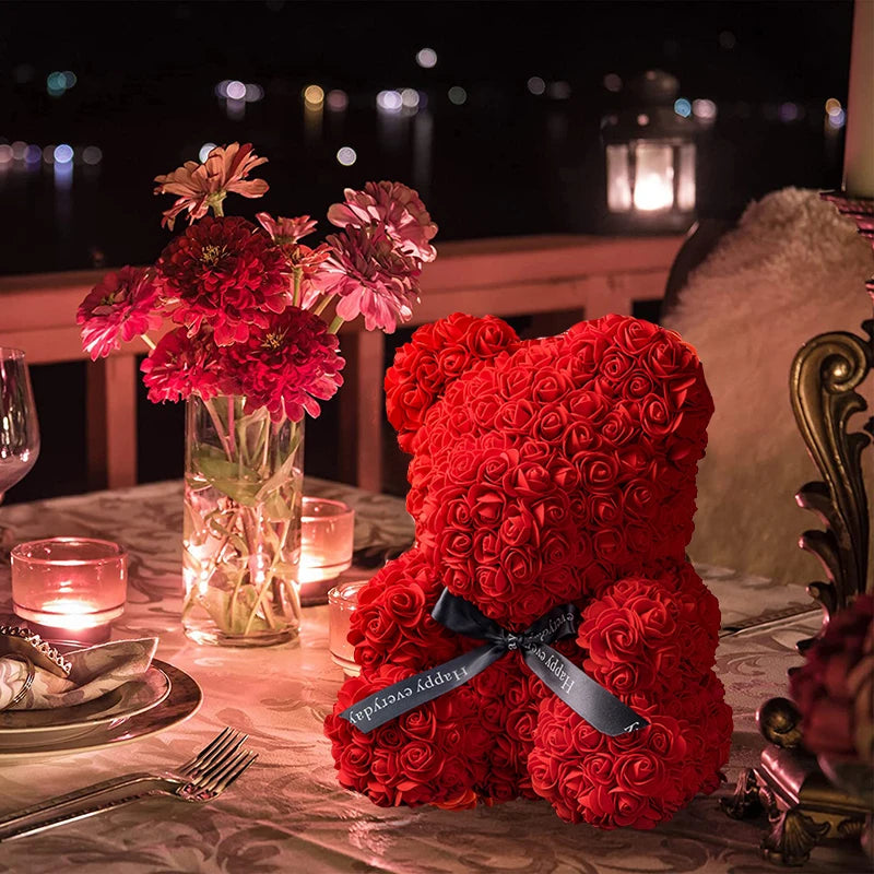 a red teddy bear sitting on top of a table