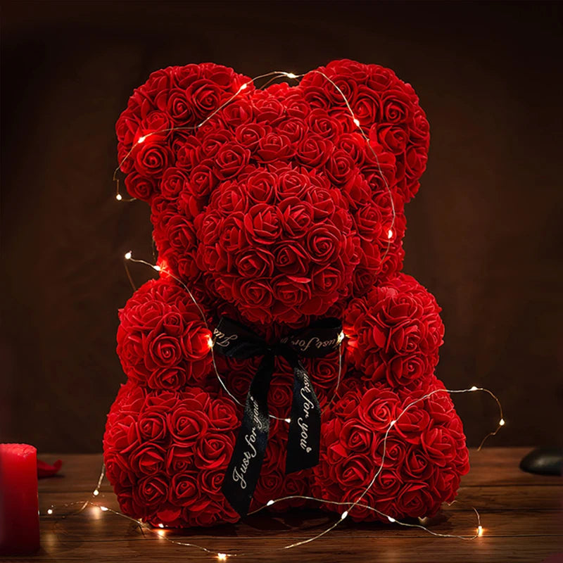 a teddy bear made out of red roses