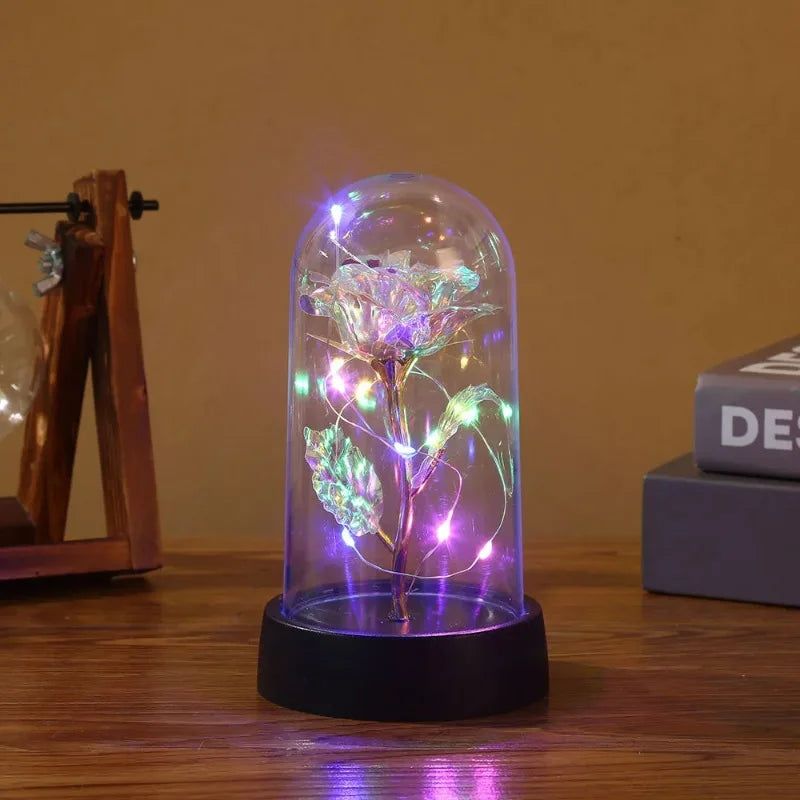 a glass dome with lights inside on a table