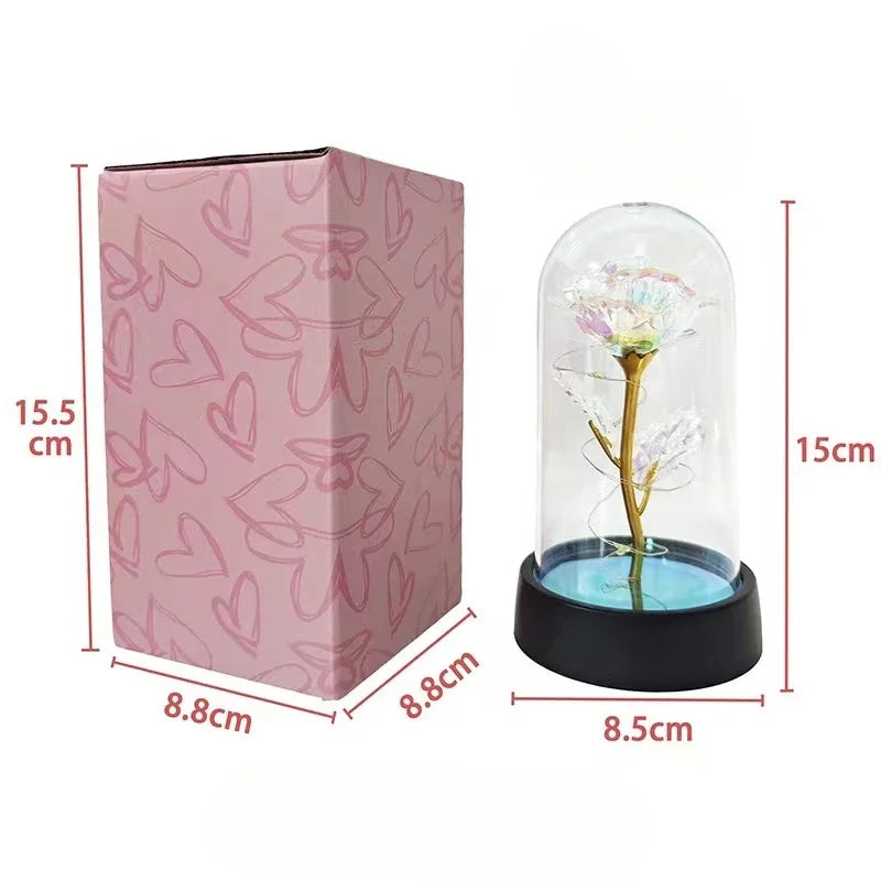 a pink box with a flower inside of it