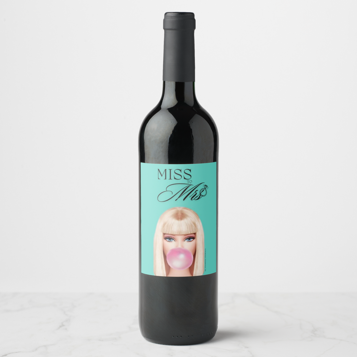 Bachelorette wine bottle featuring 'Miss to Mrs.' label with playful design and glamorous colors.