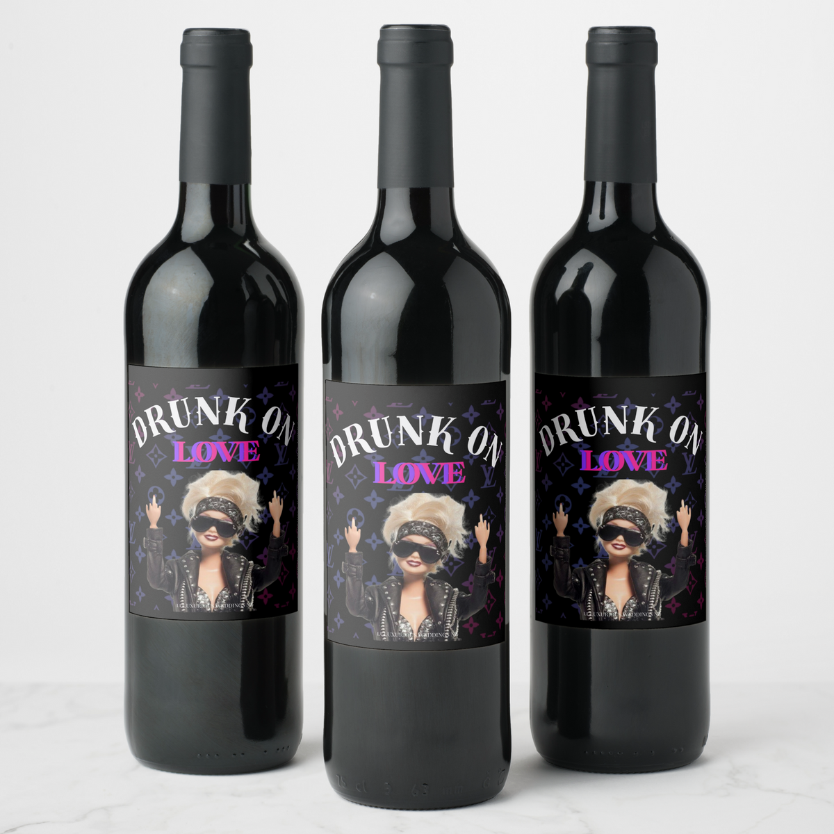 Three bachelorette wine bottles with 'Drunk on Love' labels featuring fun, stylish designs for celebrating.
