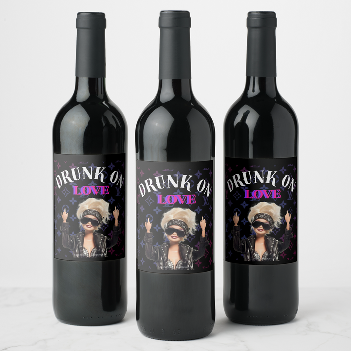 Three bachelorette wine bottles with 'Drunk on Love' labels featuring fun, stylish designs for celebrating.