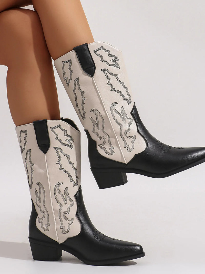 Stylish point toe block heel boots featuring intricate flame detailing in black and cream colors.