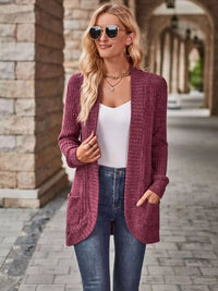 Open front ribbed knit cardigan in maroon worn with a white top and jeans, featuring pockets and a stylish look.
