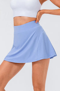 High waist pleated active skirt in light blue, made of stretchy nylon and spandex, ideal for workout wear.