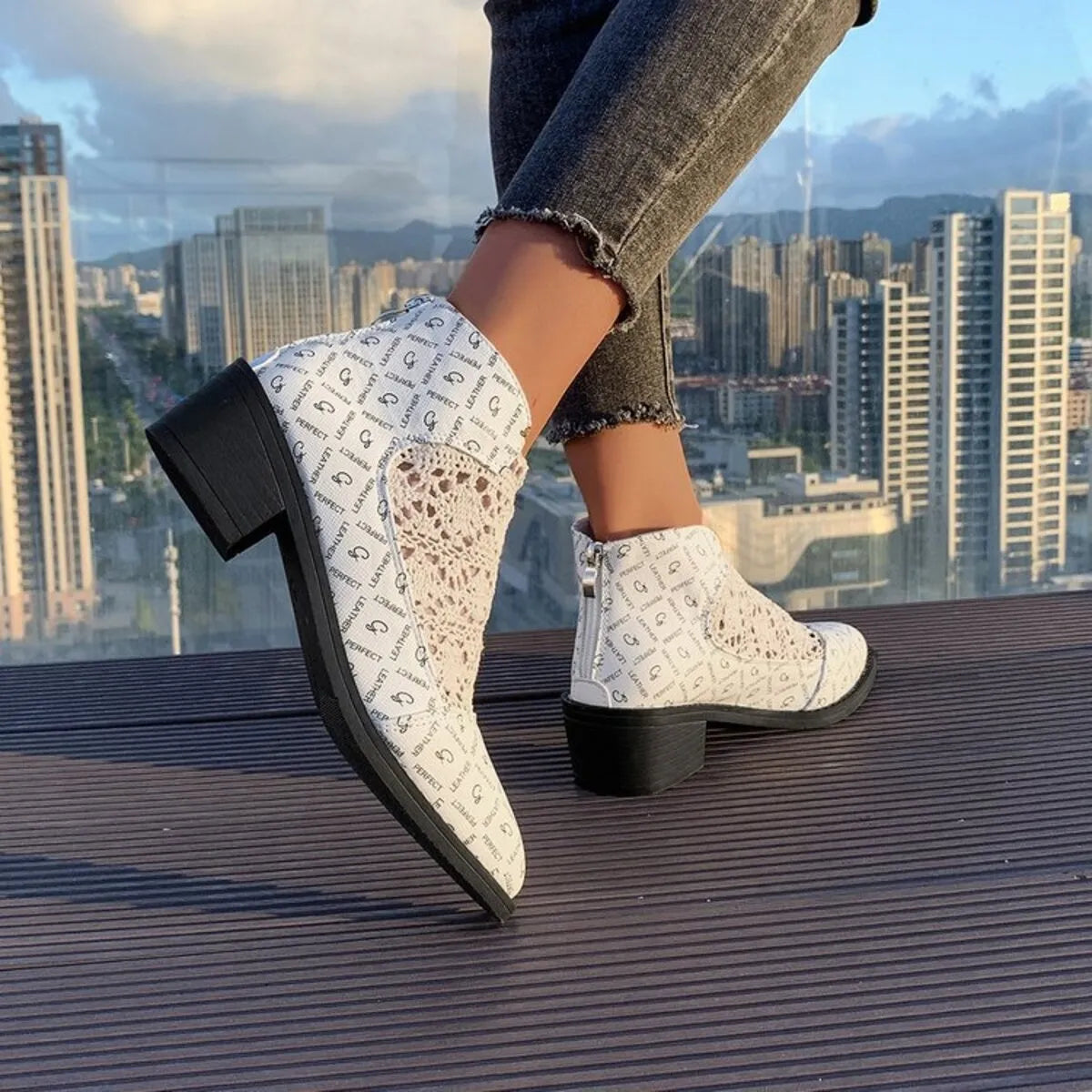 Stylish printed point toe block heel boots in mesh and PU leather, perfect for casual outfits and true to size fitting.