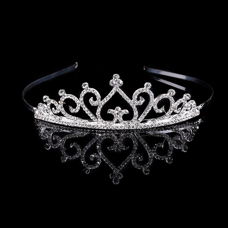 a tiara on a black background with a reflection