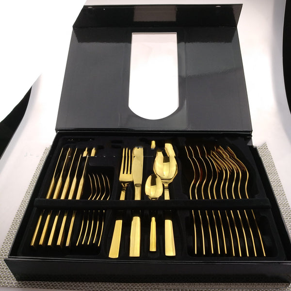 a black box with gold forks and spoons in it