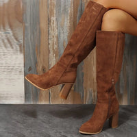 Point toe block heel boots in brown suede, featuring a high heel and knee-high design, perfect for stylish outfits.