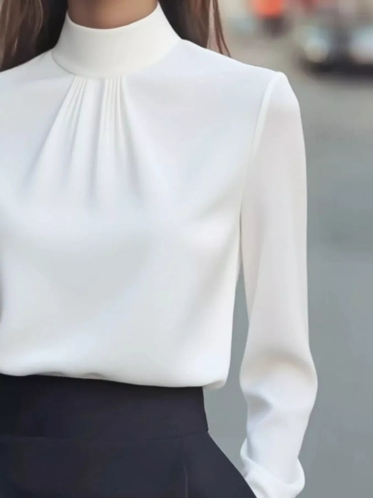 Mock Neck Long Sleeve Blouse with Pleated Detail in white fabric, featuring elegant pleated design and fitted style.