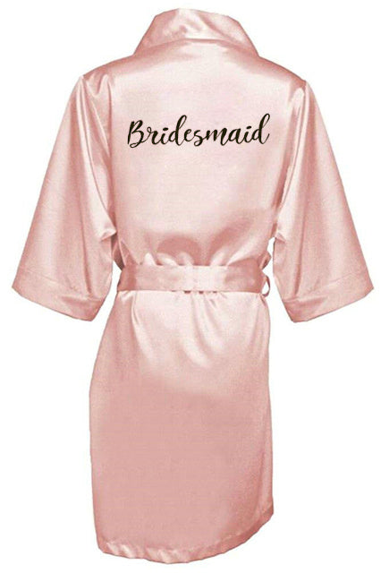 a robe that says bridesmaid on it
