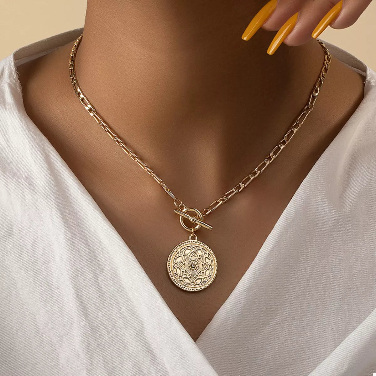 Chain Link Necklace with Vintage Coin Pendant worn by a model, featuring 18K gold-plated material.