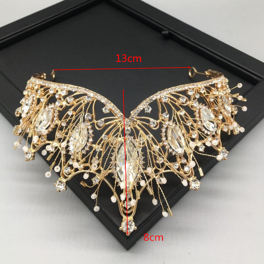 a picture of a butterfly brooch with measurements