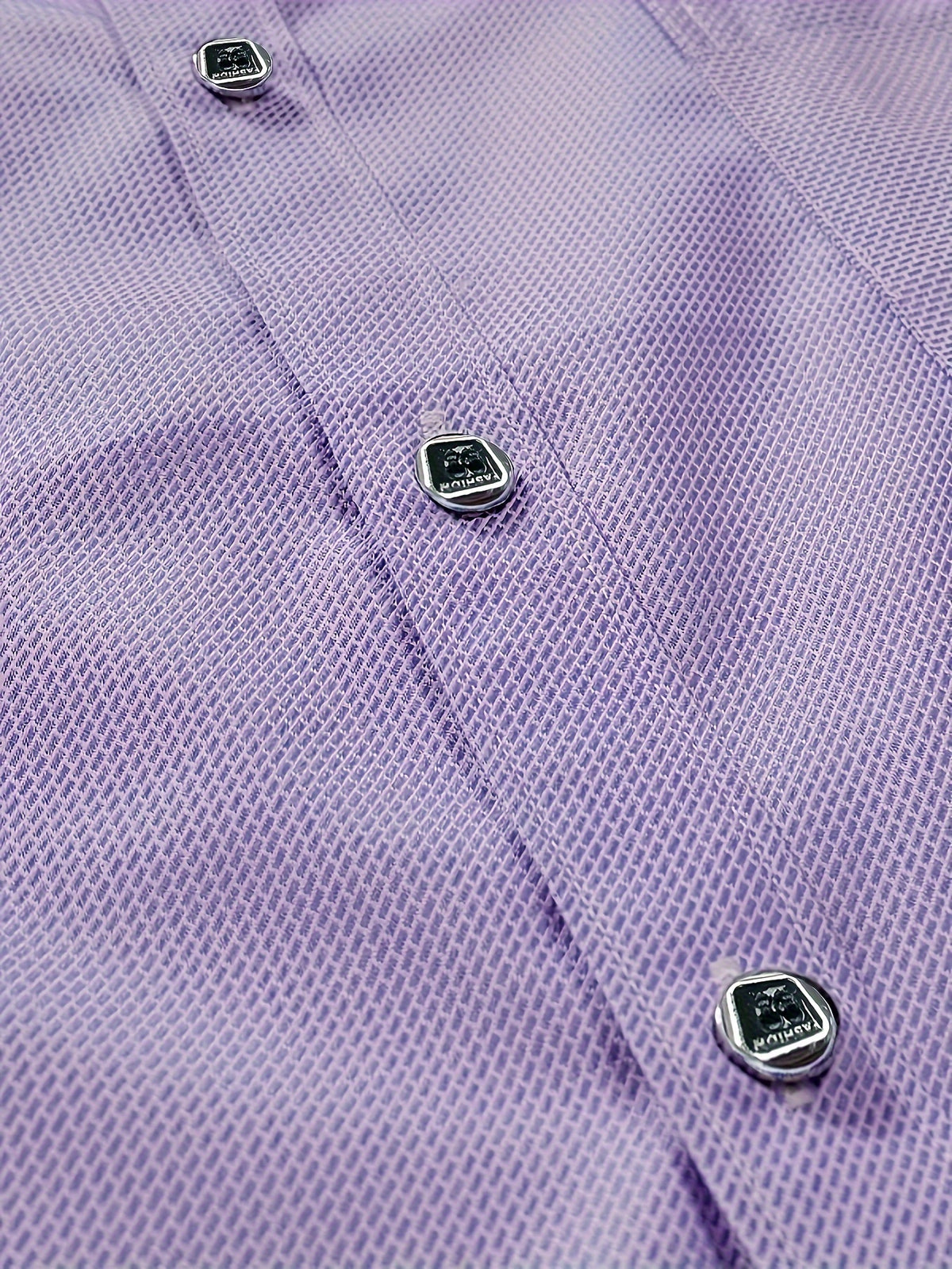 a close up of a dress shirt with buttons on it