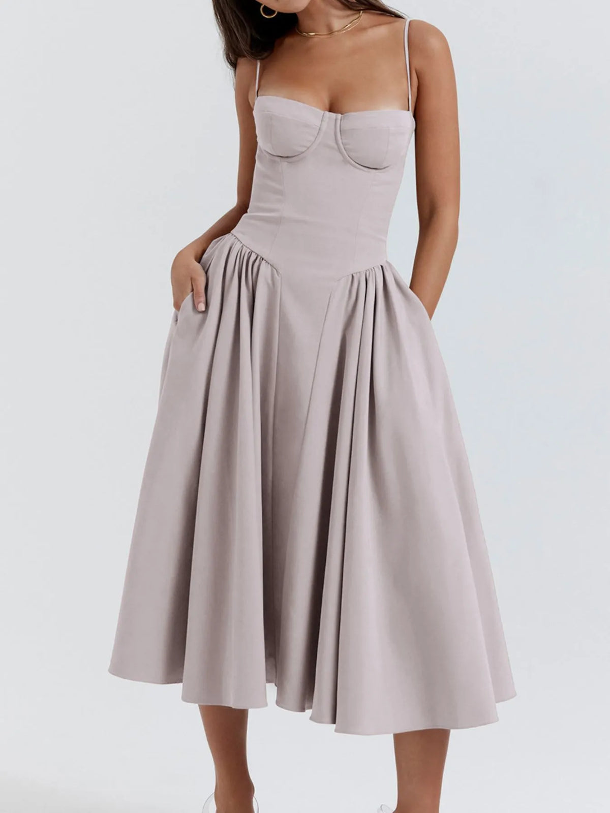 Ruched sweetheart neck cami dress in soft beige, featuring a flared skirt and side pockets, perfect for any occasion.