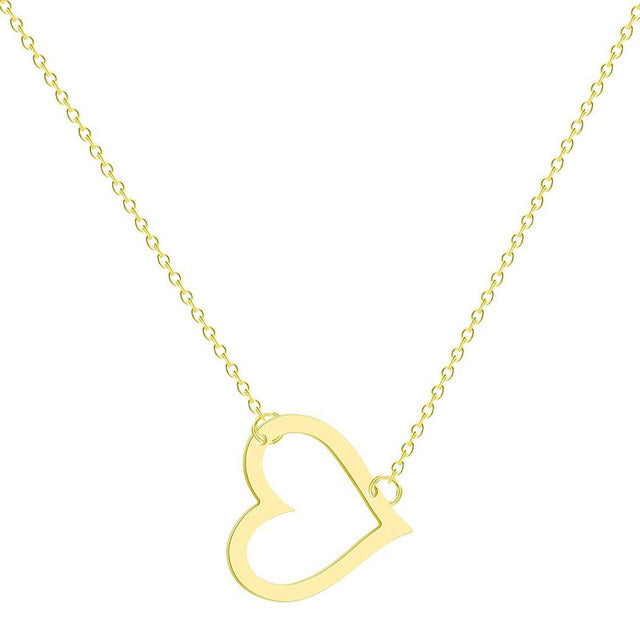 a gold necklace with a heart on it