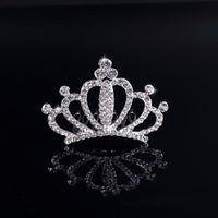 a tiara is shown on a black surface