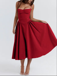 Ruched sweetheart neck cami dress in red, featuring a flowing skirt and adjustable straps perfect for casual or formal occasions.
