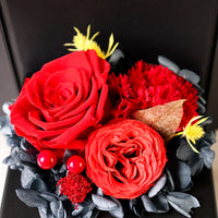 a close up of a bouquet of flowers on a chair