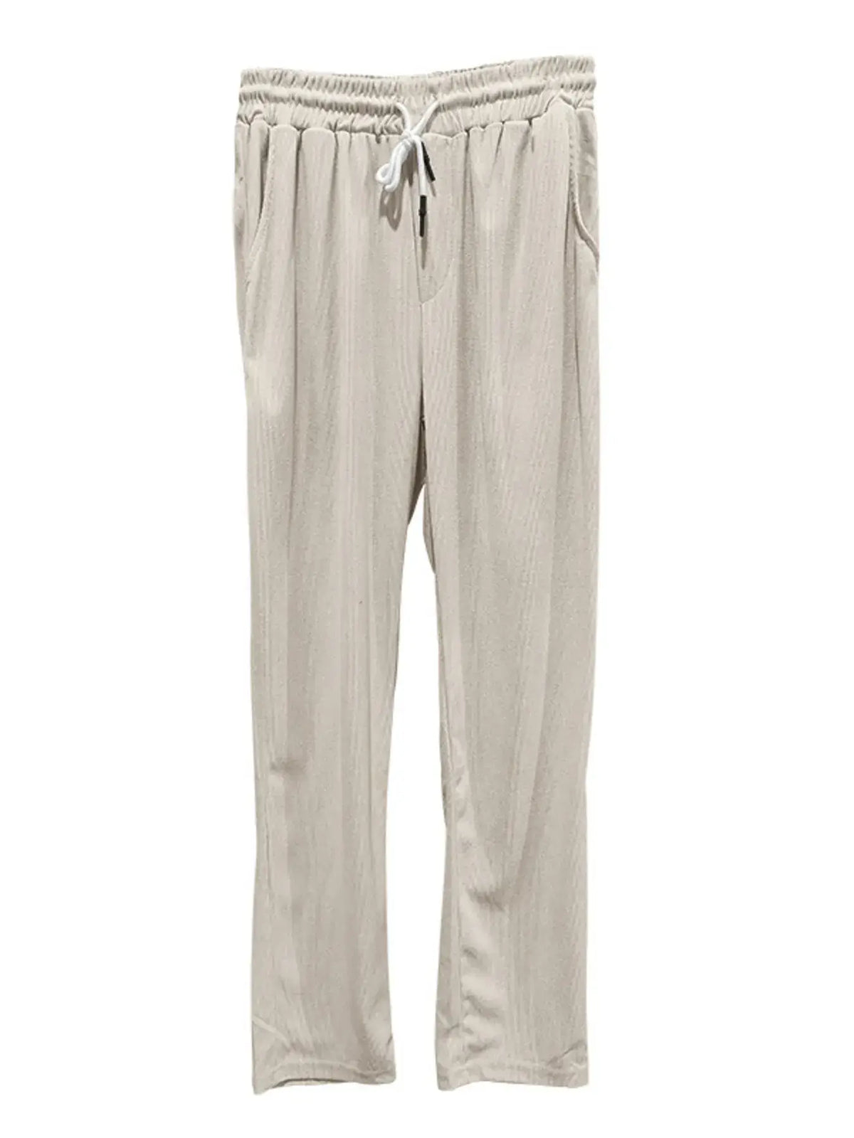 Beige drawstring pants with pockets, perfect for casual wear and relaxation.