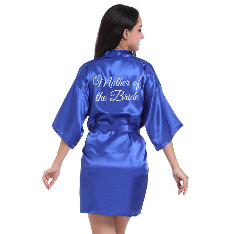 a woman in a blue robe with the words mother of the bride on it