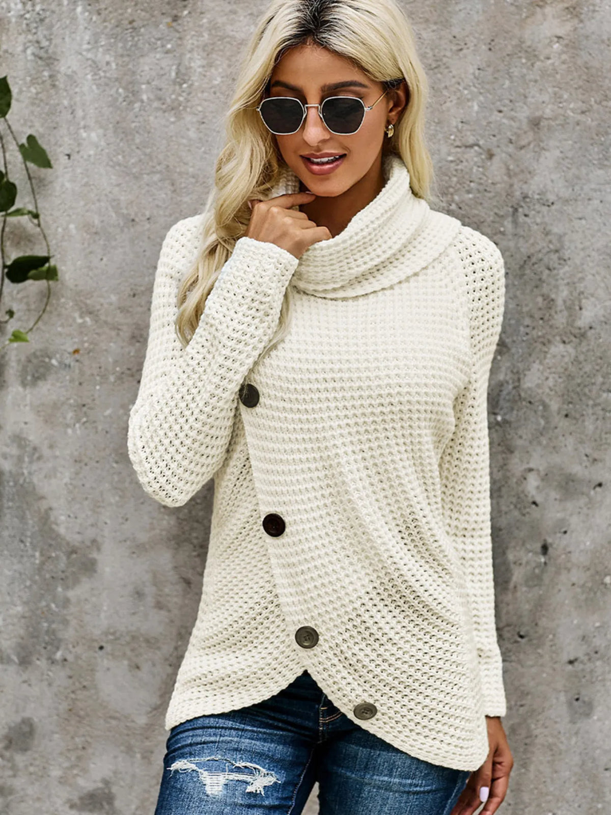 Model wearing a full size texture turtleneck long sleeve sweater with decorative buttons and stylish sunglasses.