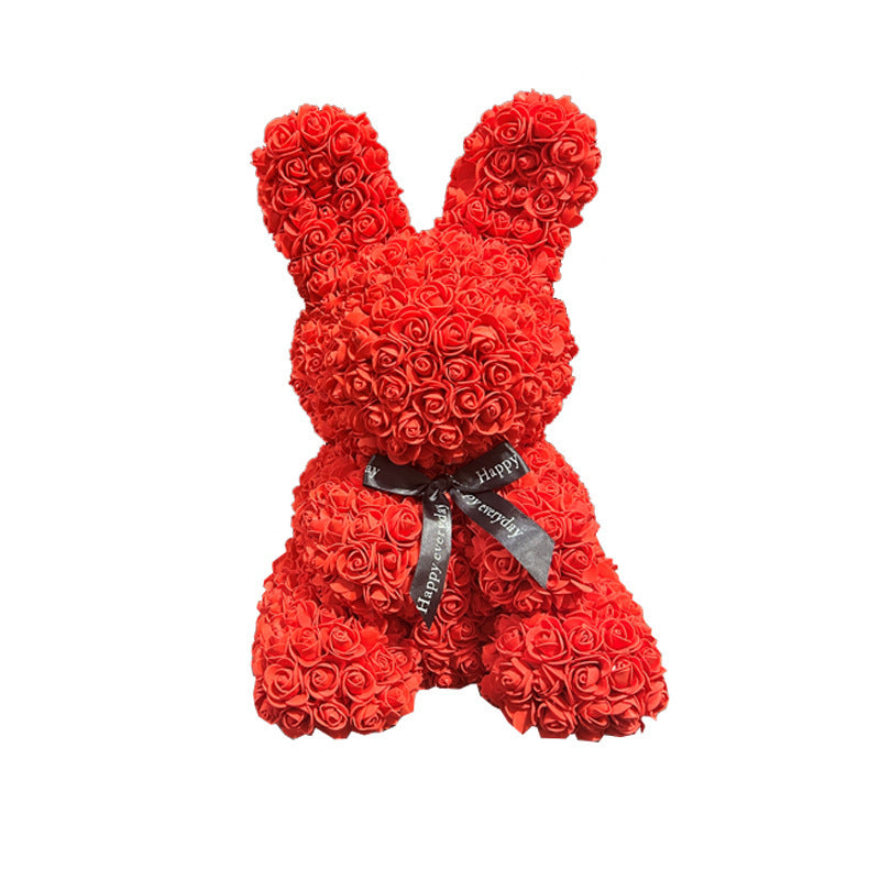 a red teddy bear made out of roses