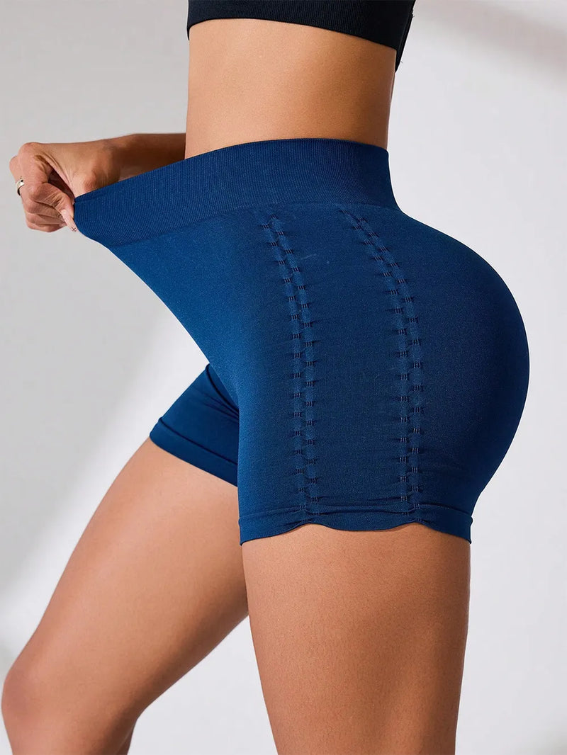 Side ruched high rise active shorts showing stretchy material and flattering fit in navy blue.