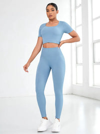 Light blue round neck short sleeve top and leggings active set, featuring a basic design and moderate stretch.