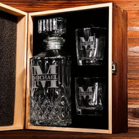 Engraved decanter set with personalized glasses in wooden gift box, ideal for special occasions.