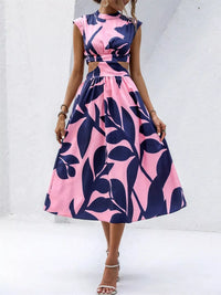 Cutout printed sleeveless dress in pink and navy floral design, featuring a tied waist and an elegant slit.