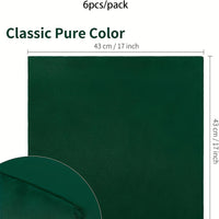 a close up of a dark green color with a white background
