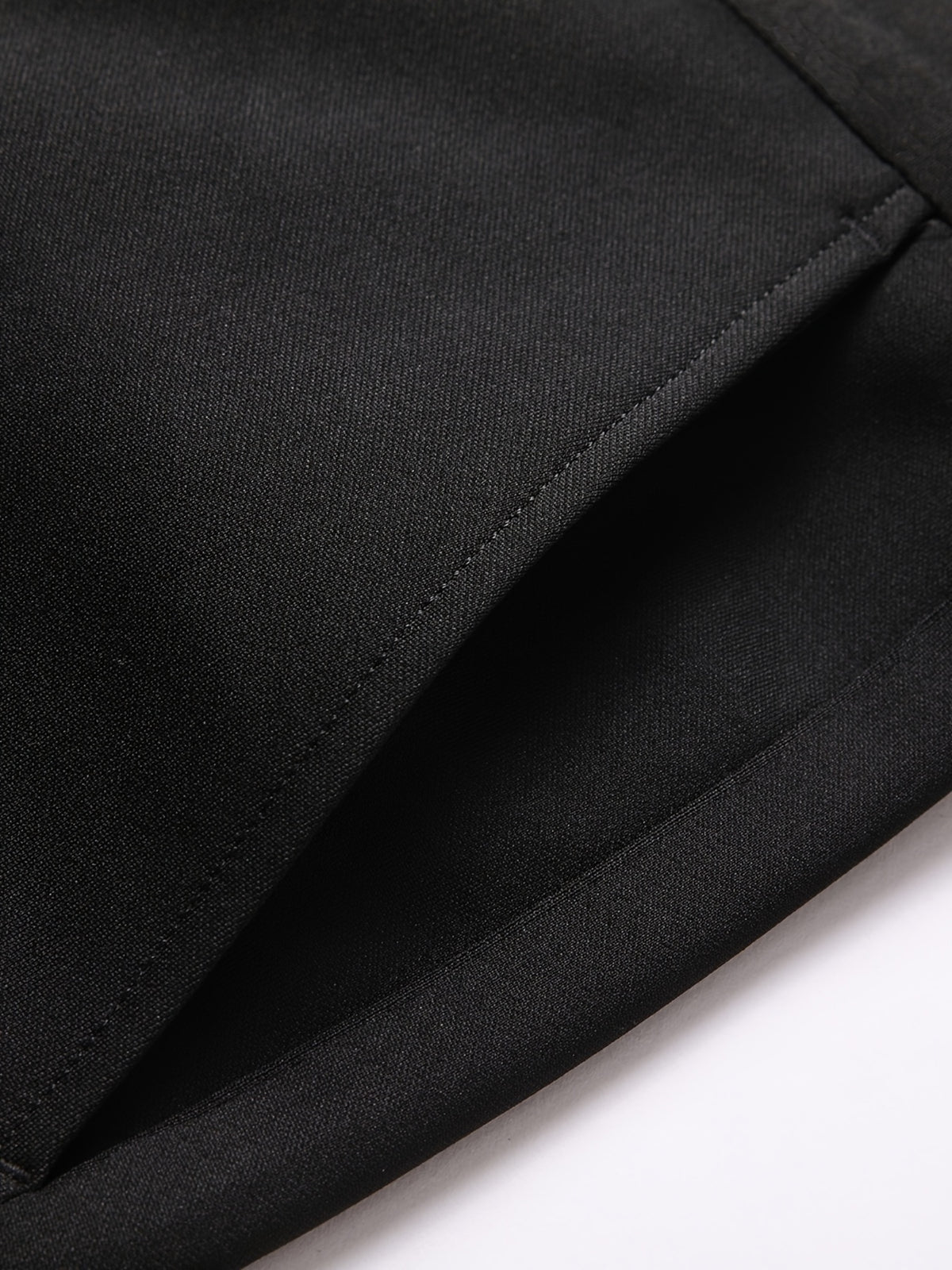 a close up of a black suit pants