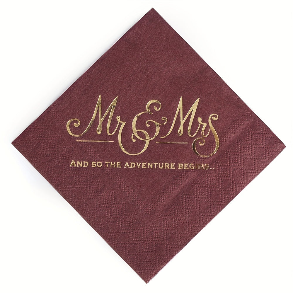 a red napkin with a gold foil lettering on it