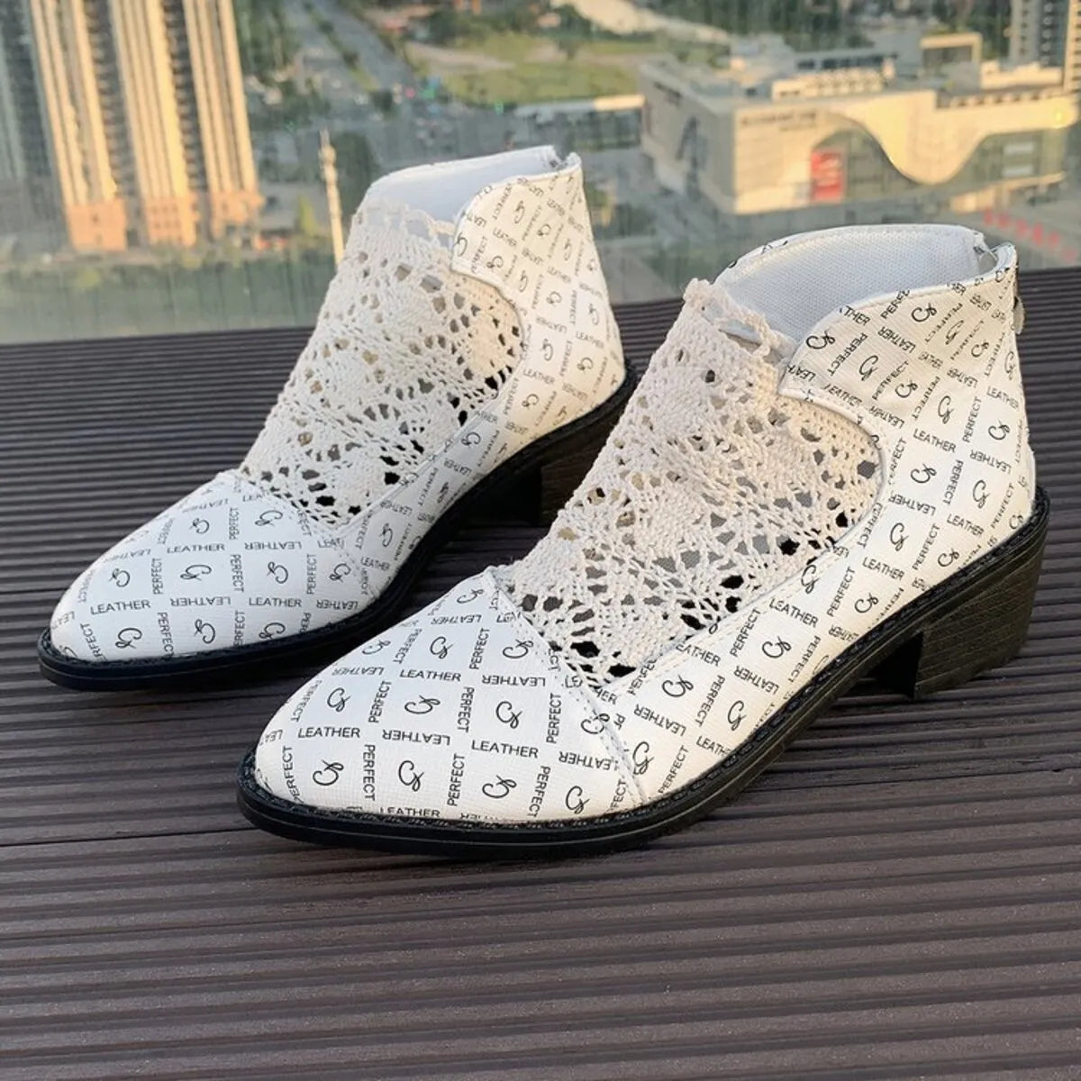 Printed point toe block heel boots with white lace design, showcasing mesh and PU leather material.