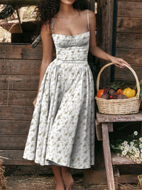 Ruched sweetheart neck cami dress in floral pattern, perfect for summer outings, paired with a basket of fresh vegetables.