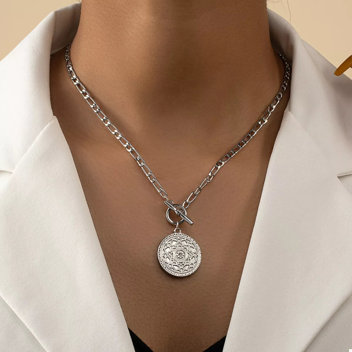 Chain Link Necklace with Vintage Coin Pendant displayed on a model's neck, showcasing its elegant design.
