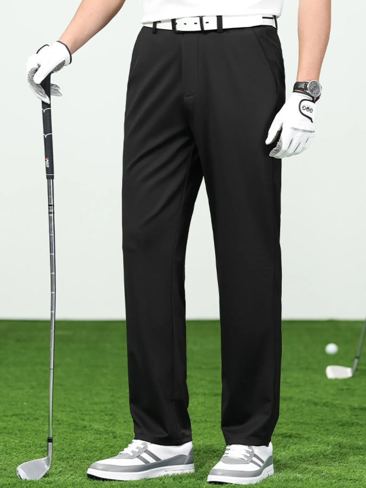 Men's loose fit black pants, perfect for golfing or casual wear, made of breathable material.