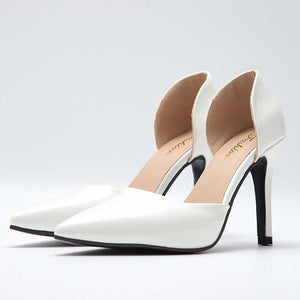 Elegant white bridal heels from the Something Blue, Something Borrowed collection, featuring a modern edge and chic style.